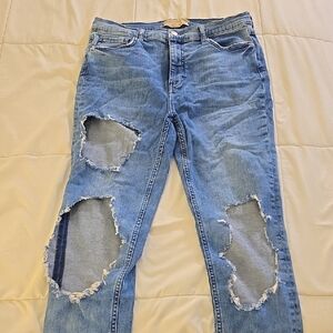 Free People High High Waisted Skinny Distressed Blue Jeans. Size 31L